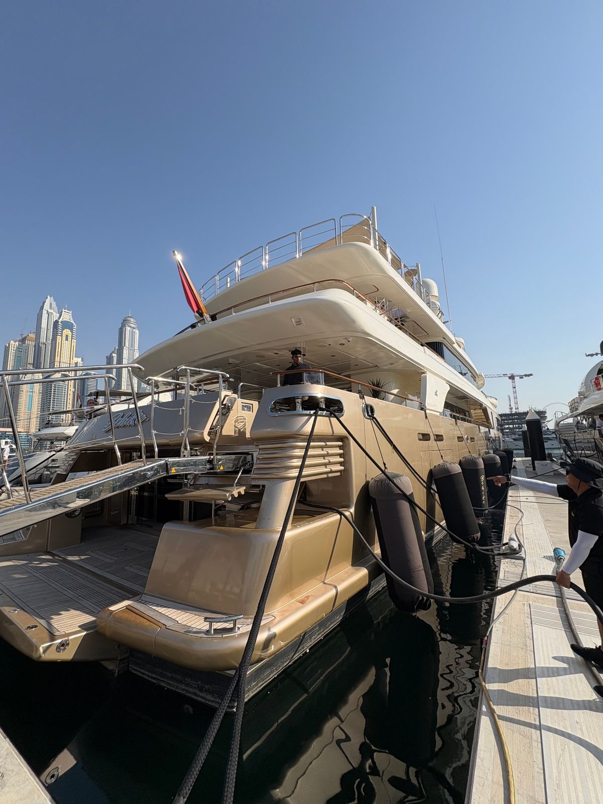 A table dressed for dinner on the deck of the superyacht Behike