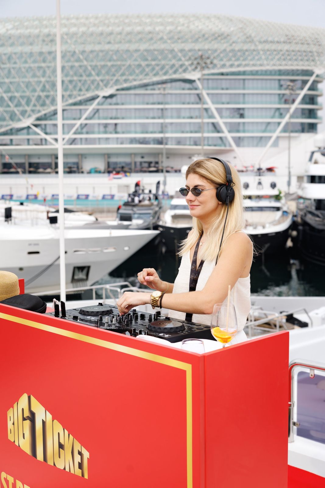 A DJ on deck in Big Ticket colours