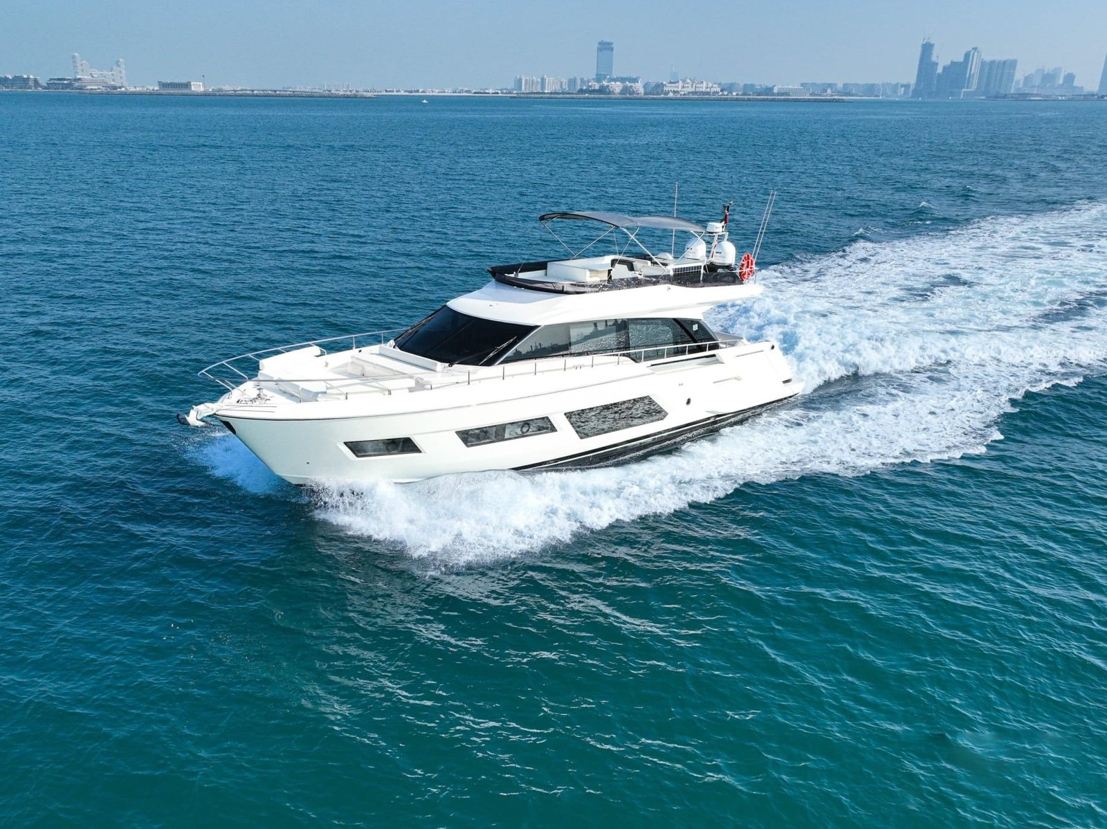 Ferretti 670 flybridge yacht underway off Palm Jumeirah