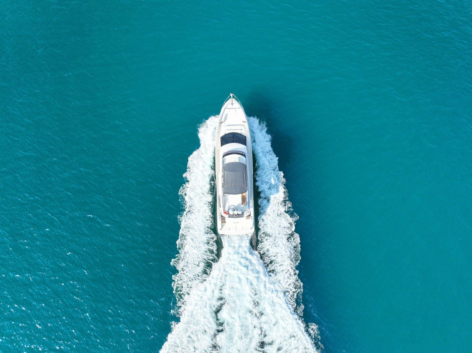 Ferretti 670 underway at sea, aerial view