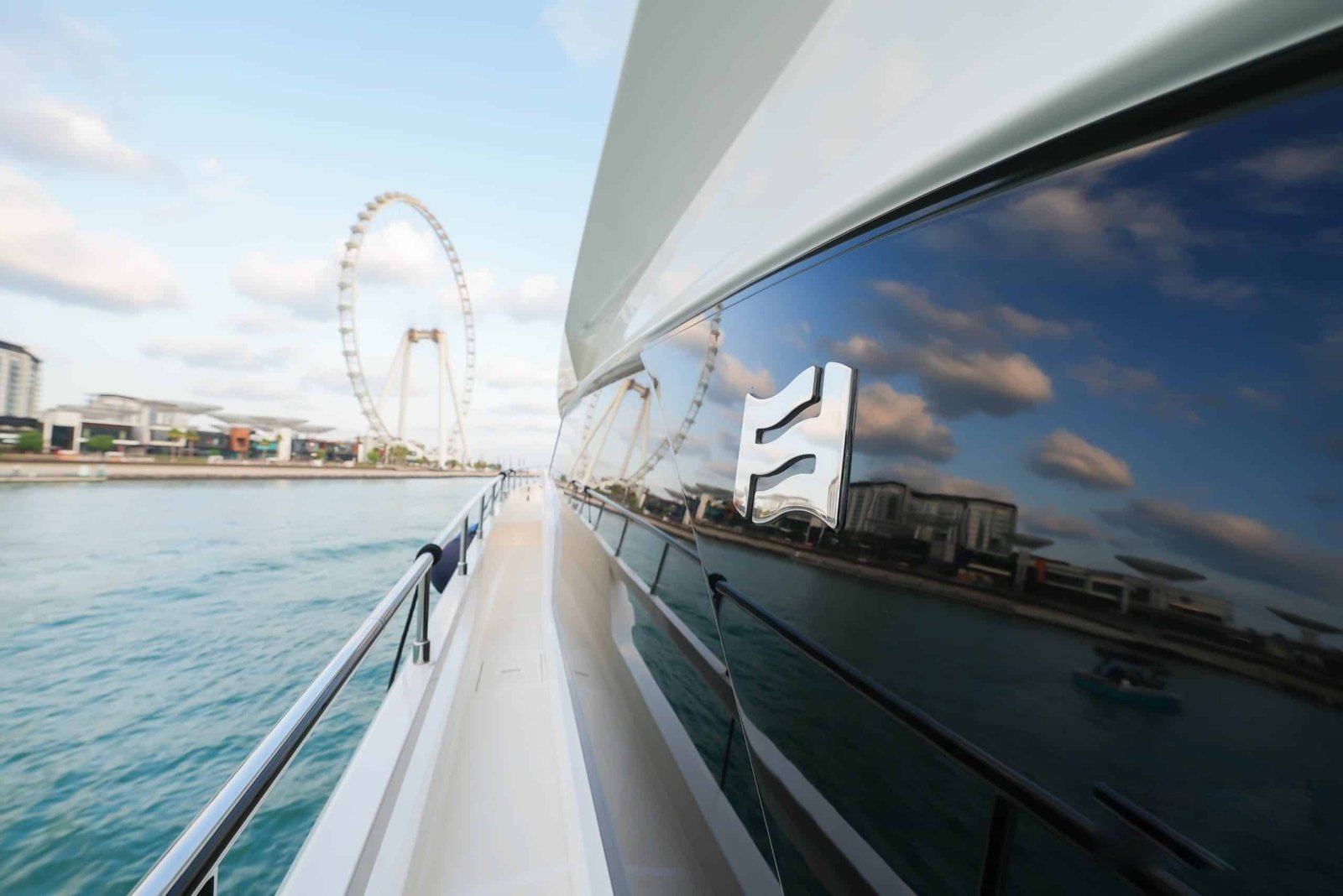 Ferretti 670 side deck with Ain Dubai behind