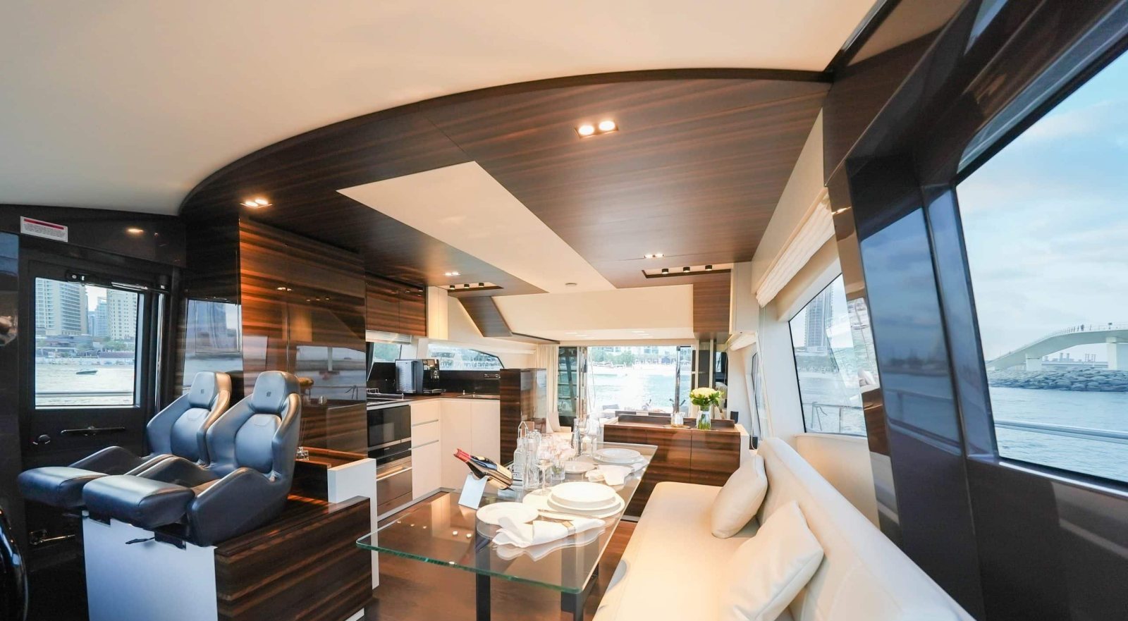 Ferretti 670 salon with dining table and galley
