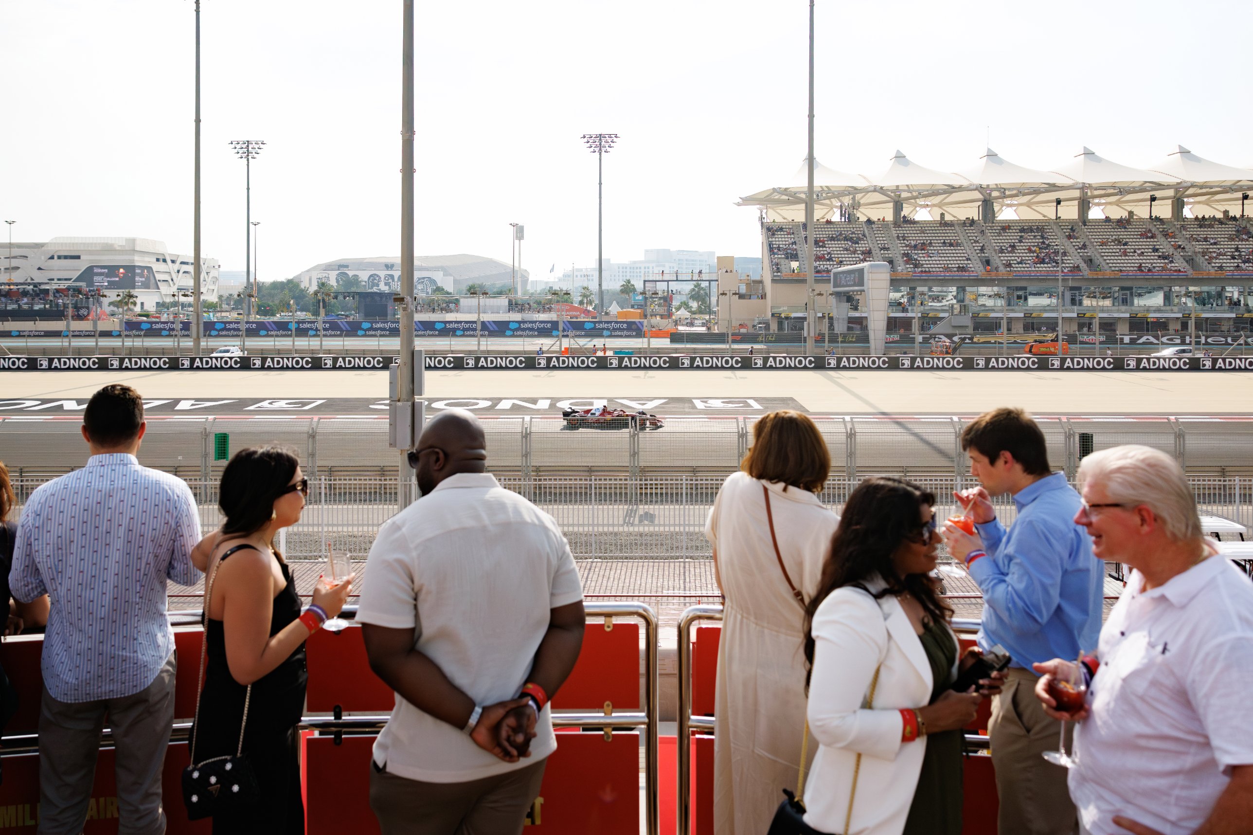 Guests on a superyacht deck watching the Abu Dhabi Grand Prix at Yas Marina