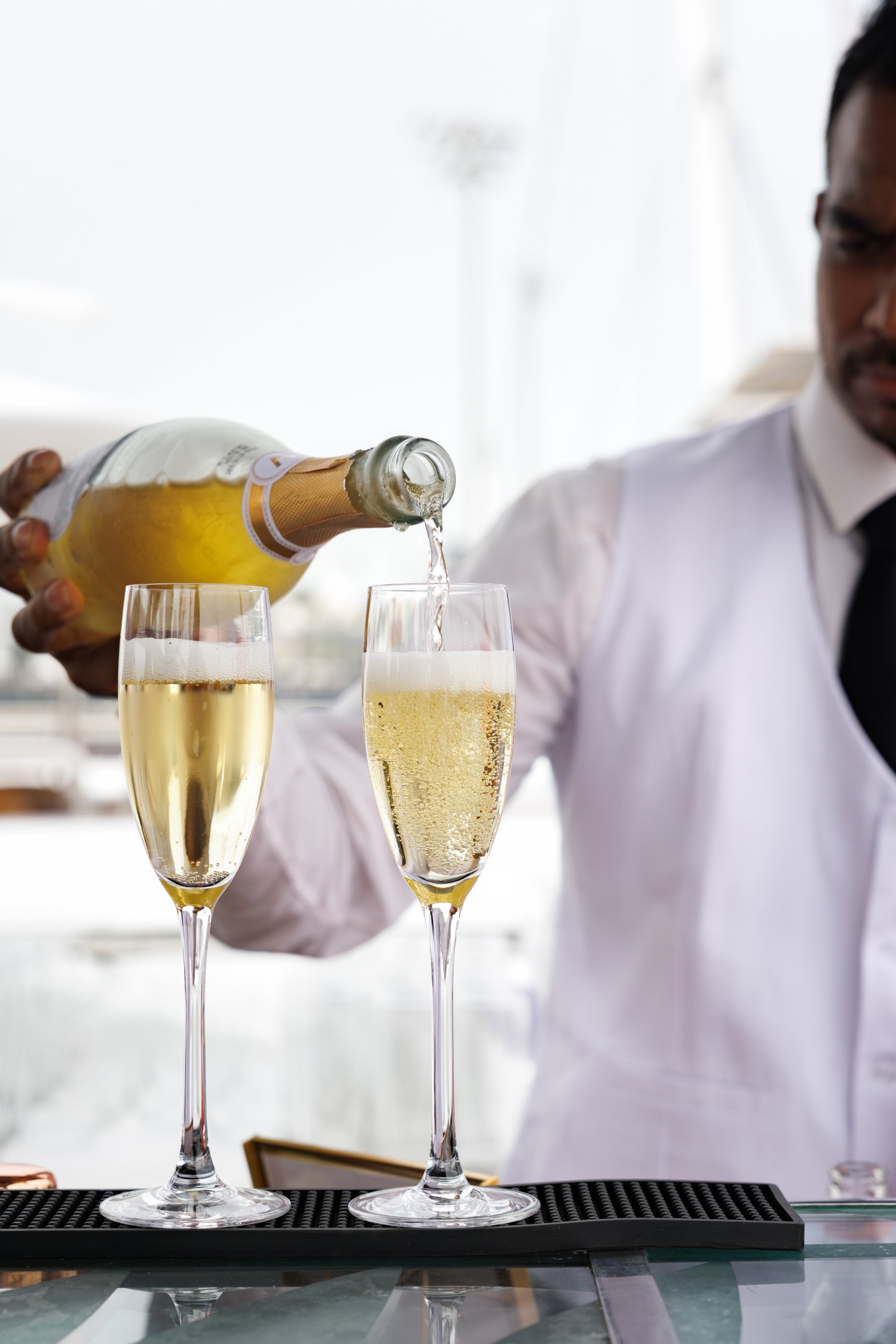 Welcome Champagne poured on board the Abu Dhabi Grand Prix yacht