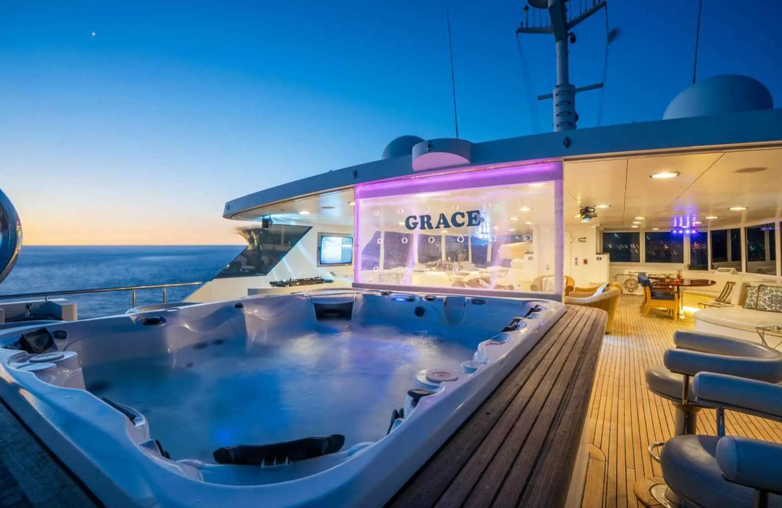 Grace aft-deck jacuzzi and bar at dusk