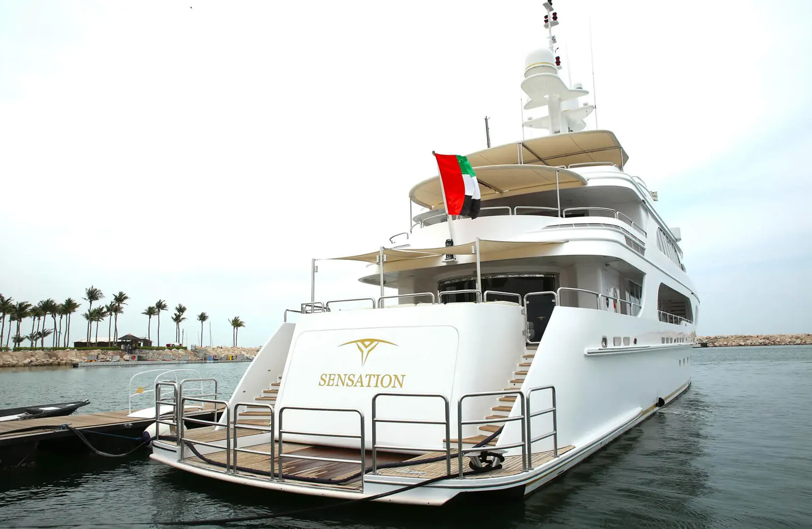 Sensation superyacht stern with UAE flag, Formula 1 hospitality yacht
