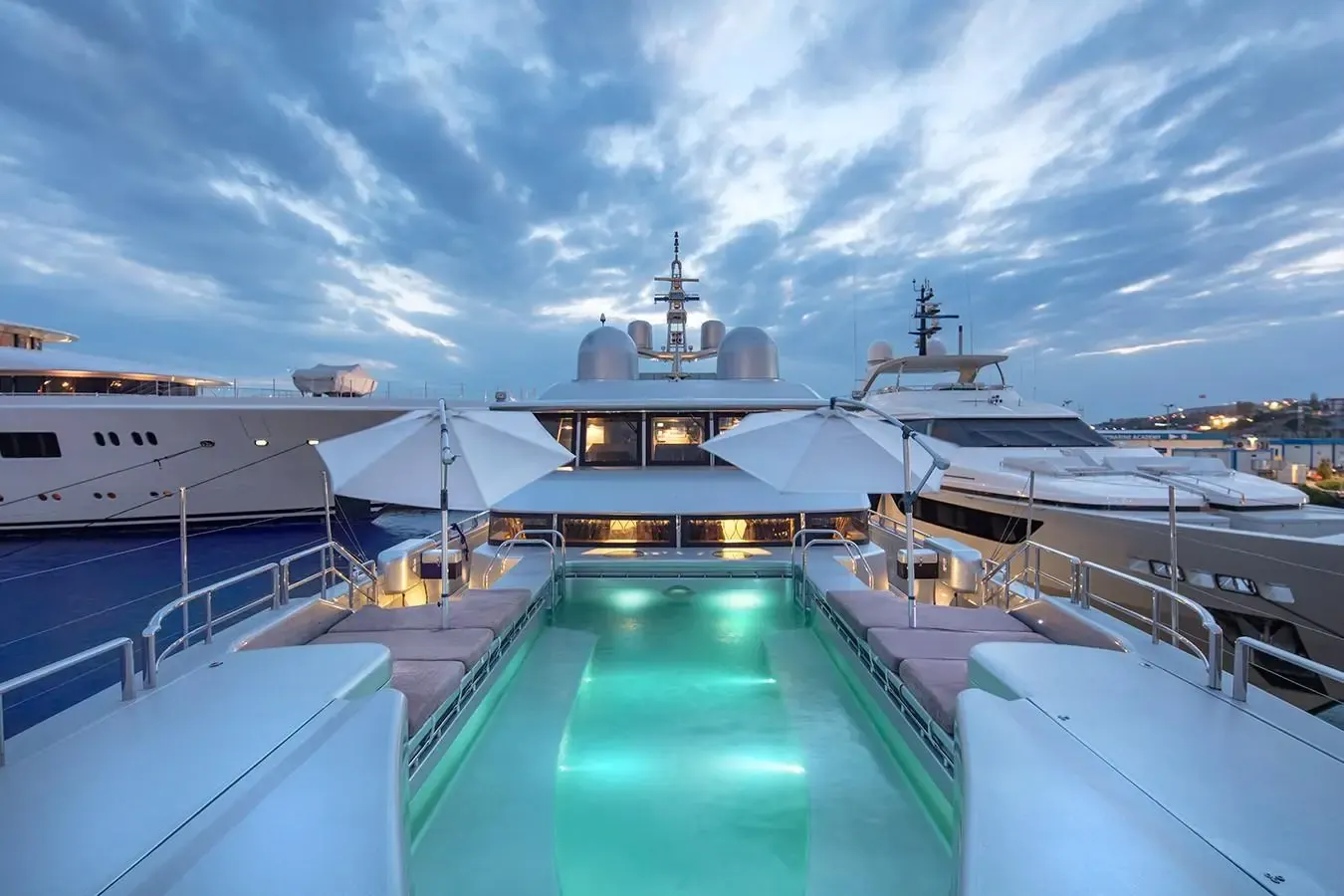 Thunder bow pool lit up at dusk, Formula 1 hospitality yacht
