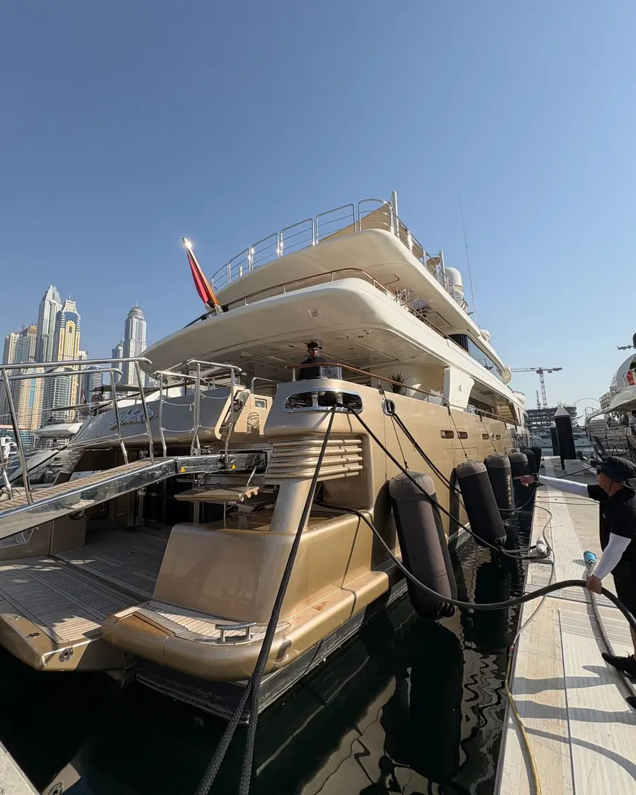 Superyacht Behike at her berth in Dubai Marina, ready for guests
