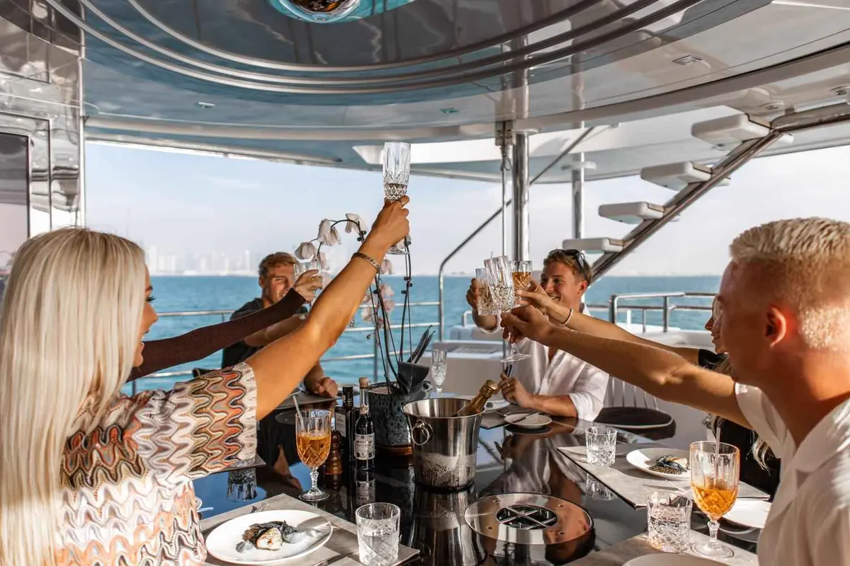 Guests toasting at a birthday celebration on a yacht in Dubai