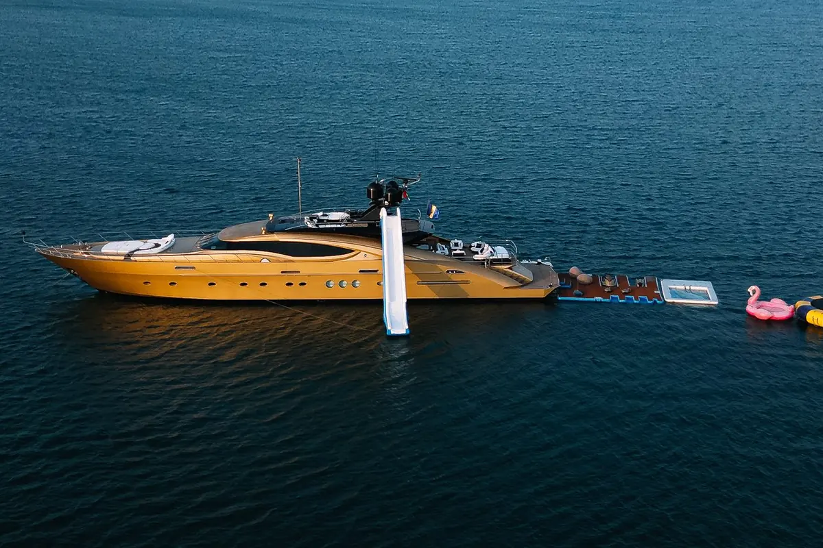 Yacht anchored off Dubai with an inflatable slide and water toys