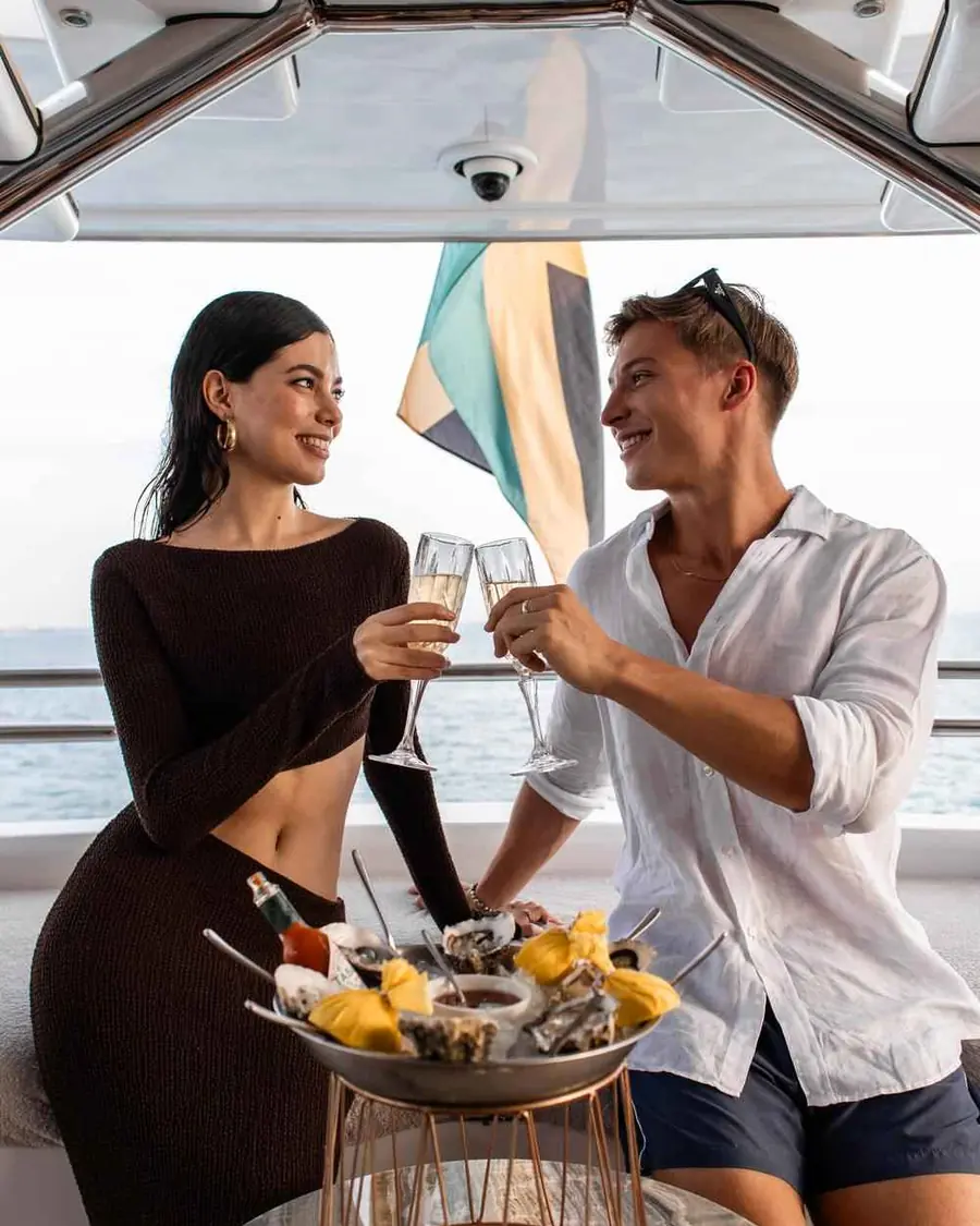 Couple celebrating with champagne on a yacht in Dubai