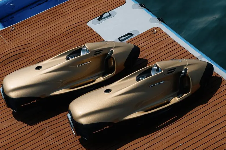 Two seabobs on the swim platform of a yacht