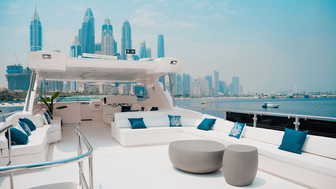 Icon flybridge lounge with the Dubai Marina skyline