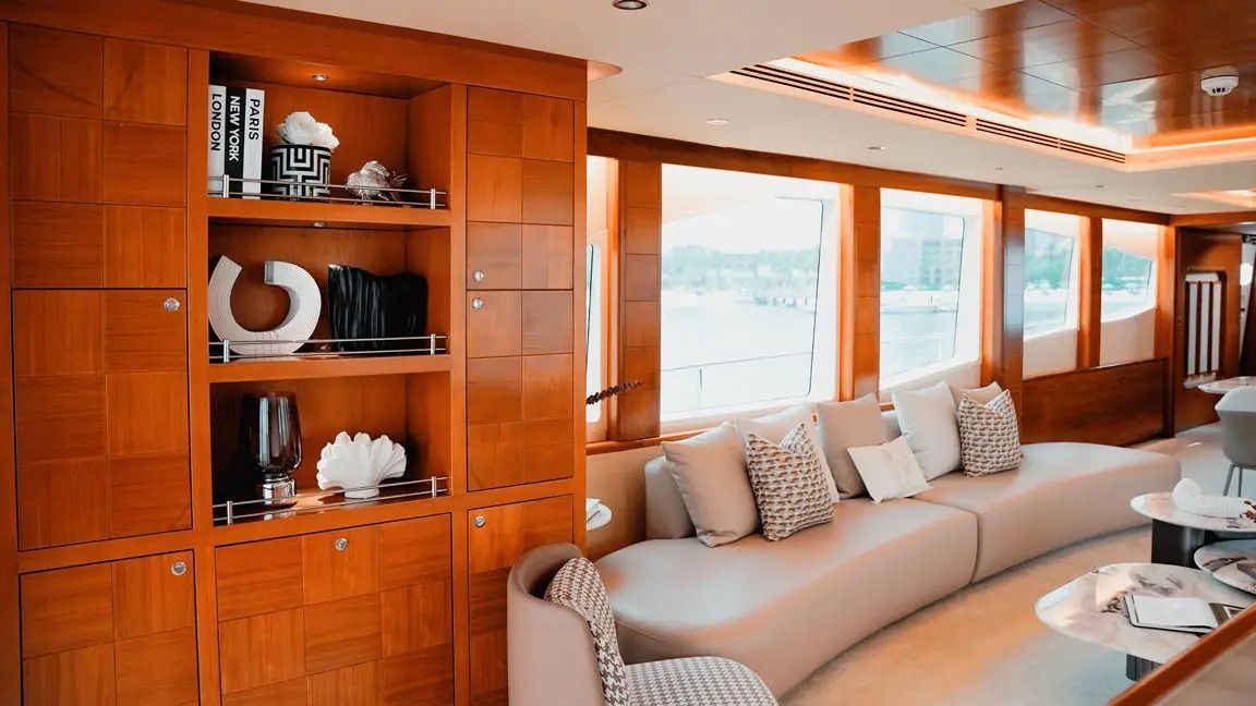 Icon salon with curved sofa and wood interior
