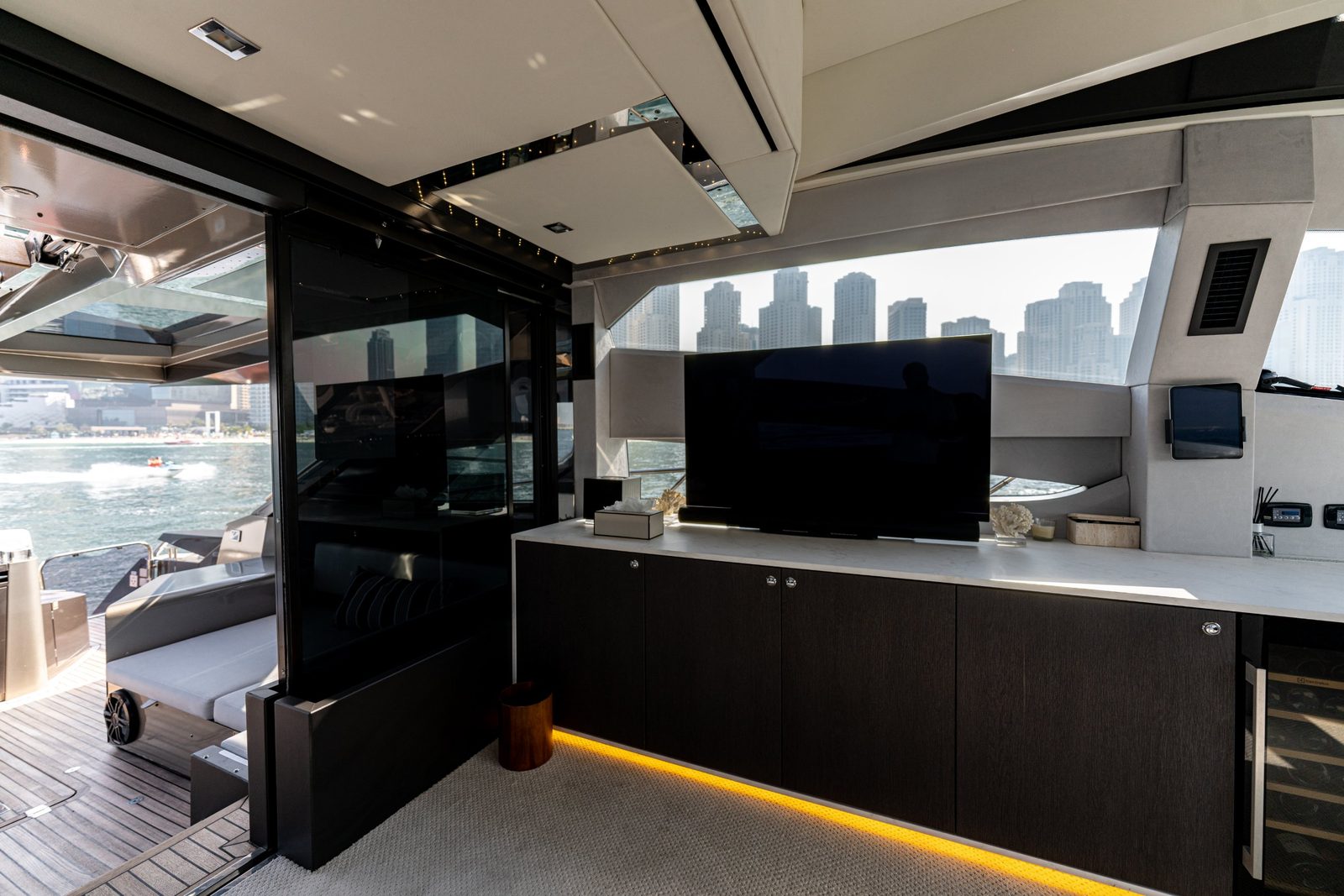 Morrigan salon sideboard with TV and Dubai Marina view