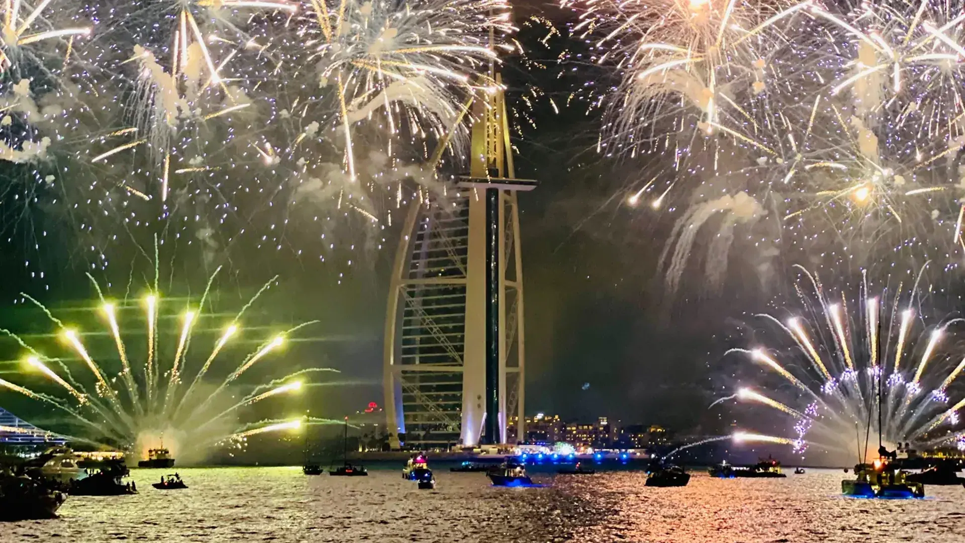 Fireworks over the Burj Al Arab seen from the water on New Year’s Eve